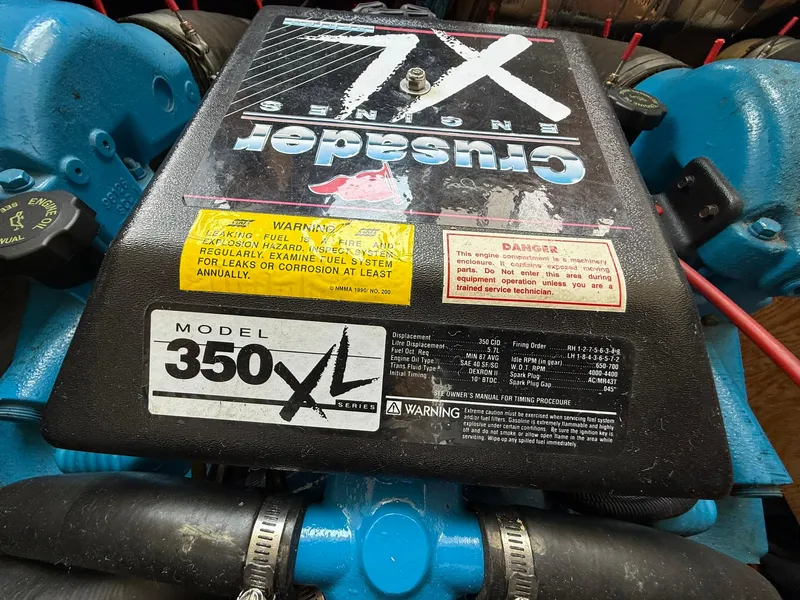 Slide: The Image of Engine of a 1996 Carver 325 Aft Cabin, featuring Crusader Model 350 XL. - 40