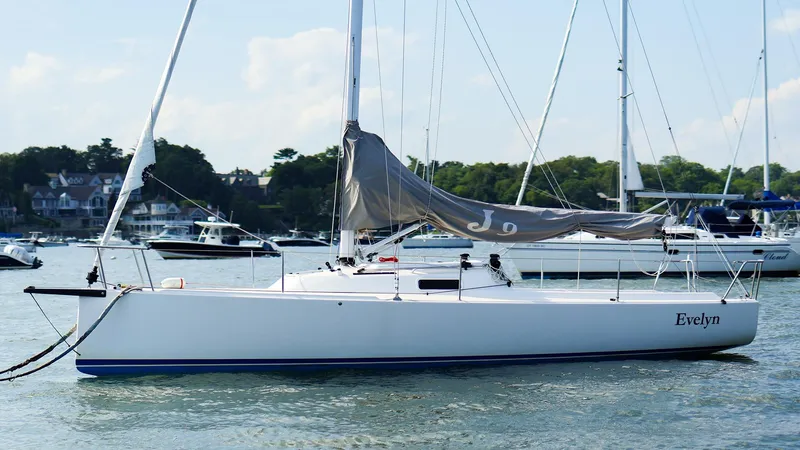 The Image of 2022 J Boats J/9 sailboat named Evelyn on calm water, surrounded by other boats. - 0