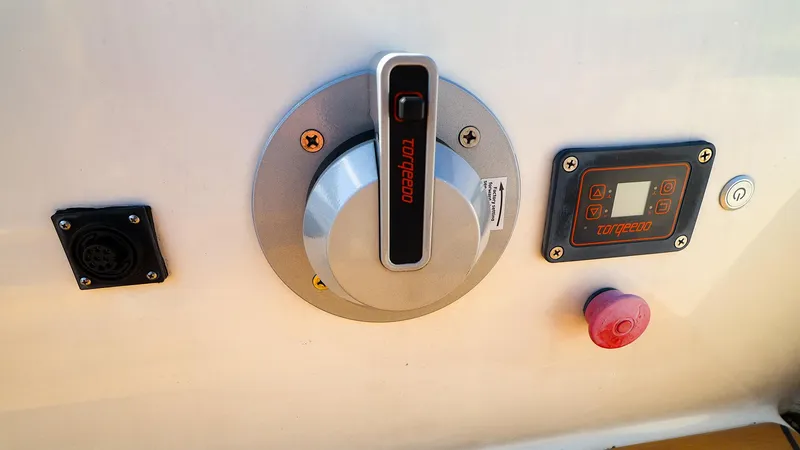Slide: The Image of Control panel of a 2022 J Boats J/9 sailboat featuring Torqeedo throttle and display. - 11