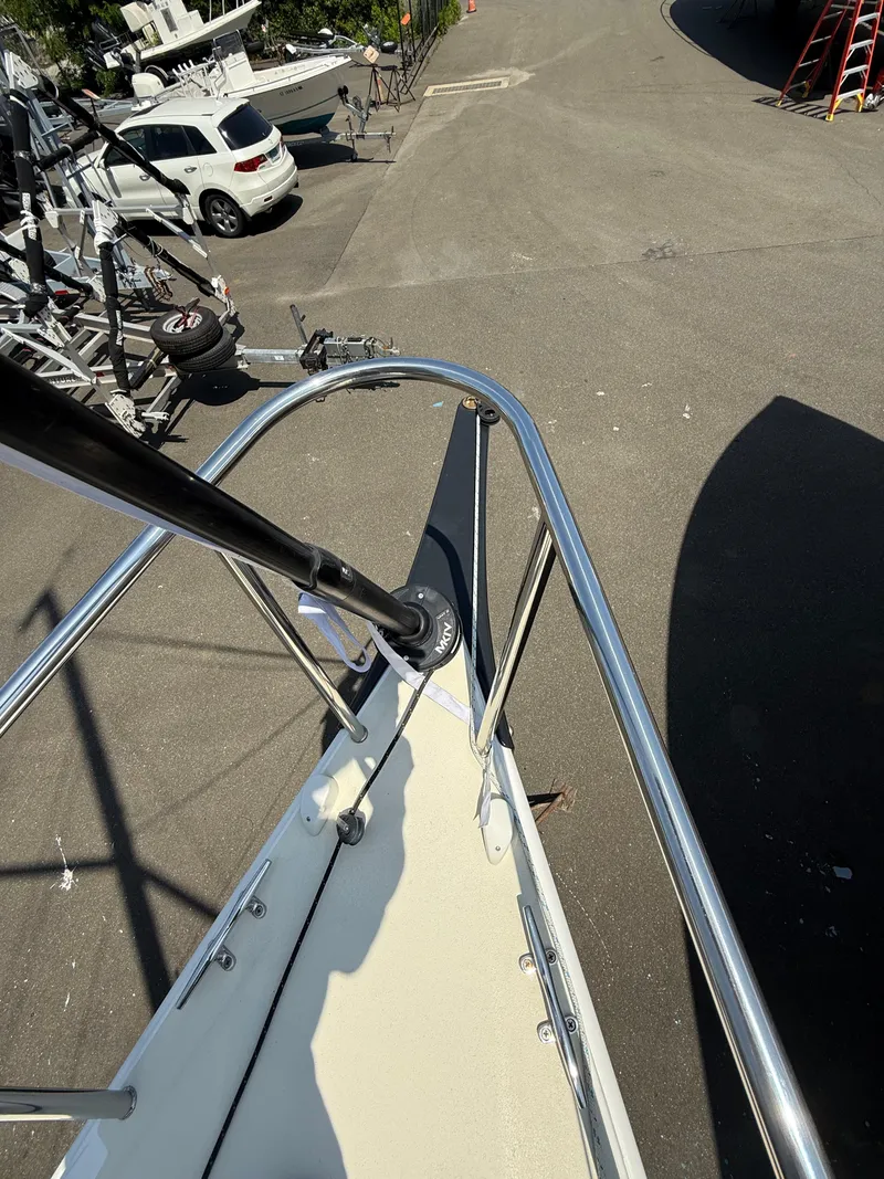 Slide: The Image of 2022 J Boats J/9 sailboat bow with stainless steel railing in a marina. - 35