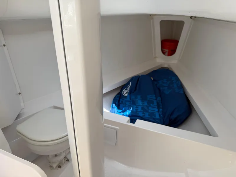 Slide: The Image of 2022 J Boats J/9 interior cabin with toilet and storage area. - 48