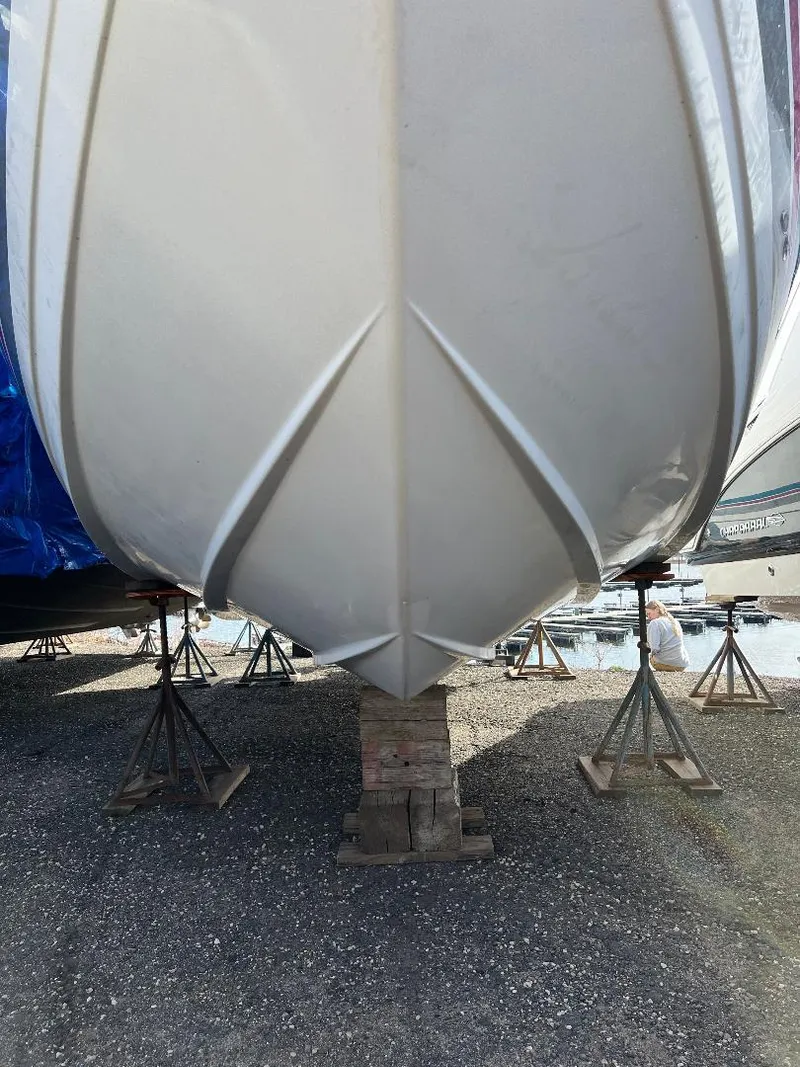 Slide: The Image of 1994 Formula 31 PC boat hull on stands, viewed from below. - 15