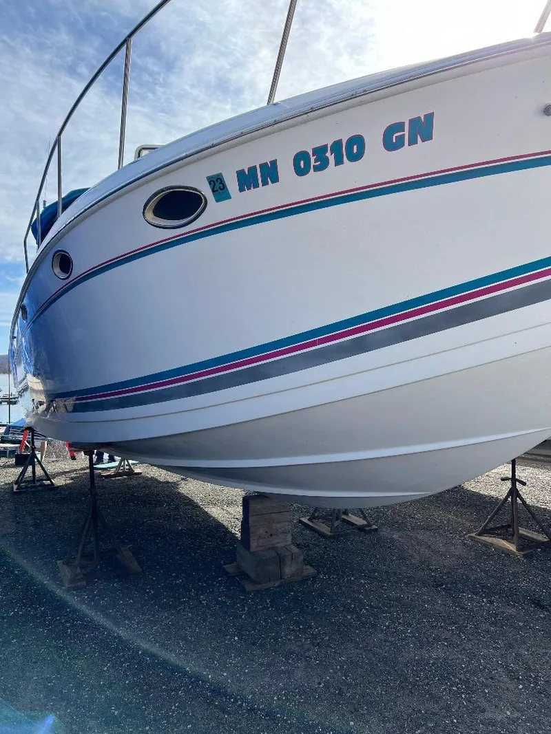 Slide: The Image of 1994 Formula 31 PC boat on stands, displaying registration number MN 0310 GN. - 17