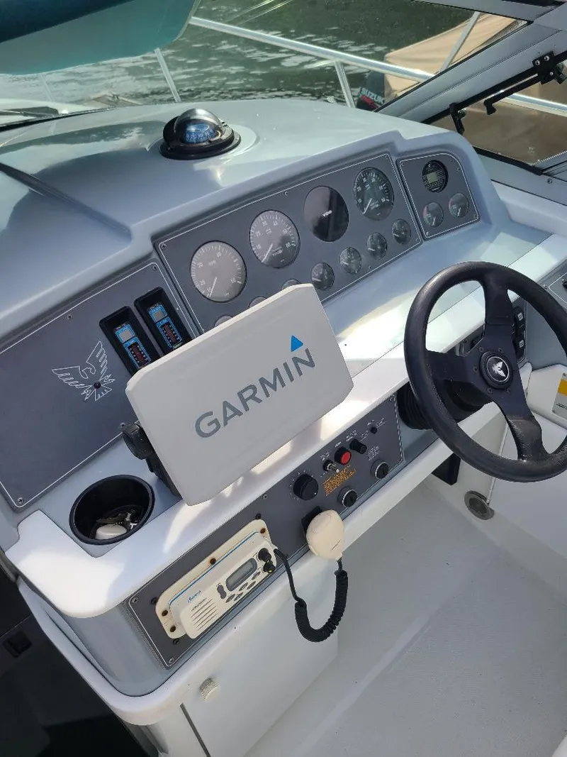 Slide: The Image of 1994 Formula 31 PC boat dashboard with Garmin navigation system and control panel. - 3