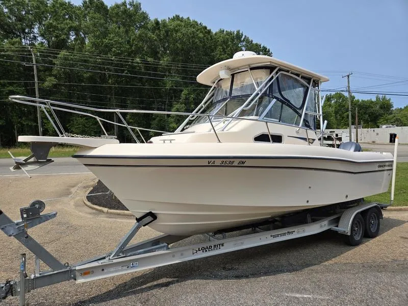 The Image of 2007 Grady-White 232 Gulfstream boat on trailer, parked outdoors. - 0