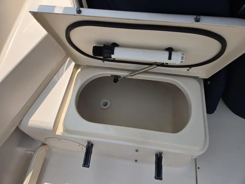 Slide: The Image of Open storage compartment on 2007 Grady-White 232 Gulfstream boat. - 16