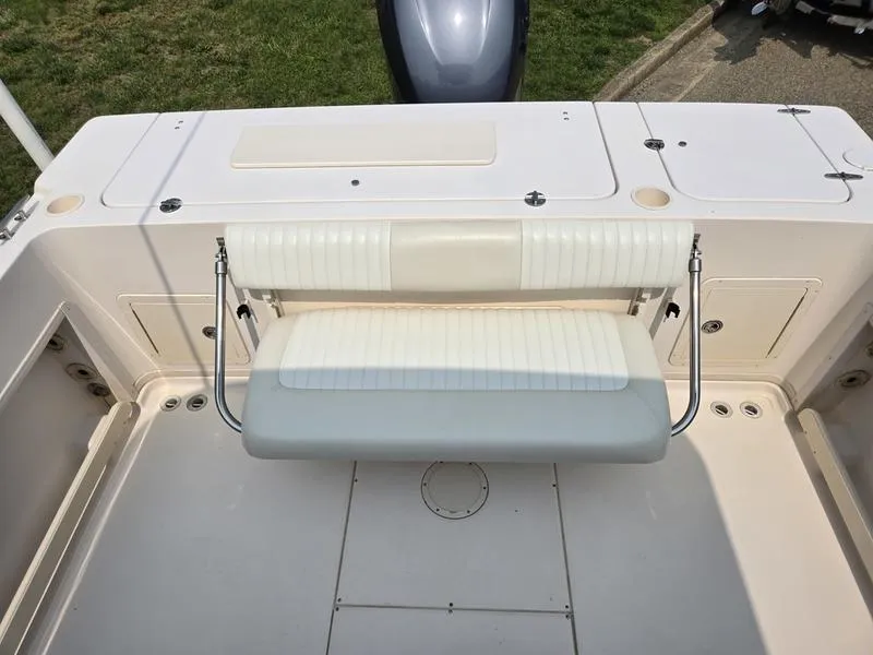 Slide: The Image of 2007 Grady-White 232 Gulfstream boat interior with foldable bench seat. - 17