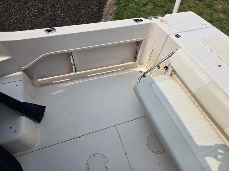 Slide: The Image of 2007 Grady-White 232 Gulfstream boat interior with seating and storage area. - 19