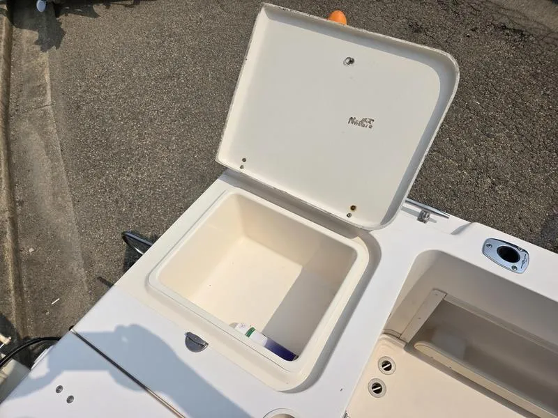 Slide: The Image of Open storage compartment on a 2007 Grady-White 232 Gulfstream boat. - 20