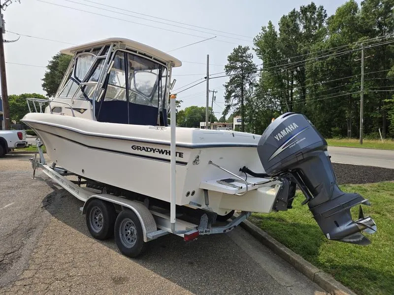 Slide: The Image of 2007 Grady-White 232 Gulfstream boat on trailer with Yamaha outboard motor. - 24