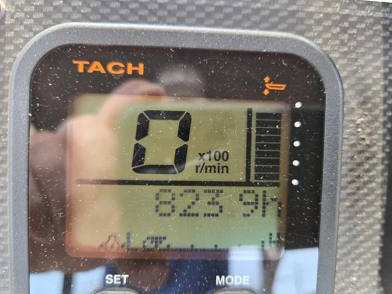 Slide: The Image of Tachometer display on 2007 Grady-White 232 Gulfstream boat showing 0 RPM and 823.9 hours. - 9