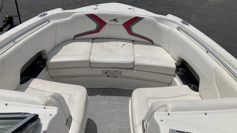 Slide: The Image of 2010 Monterey M5 Sport Boat with white and red cushioned seating. - 10