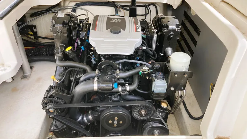 Slide: The Image of Engine compartment of a 2010 Monterey M5 Sport Boat, showcasing detailed mechanical components. - 11