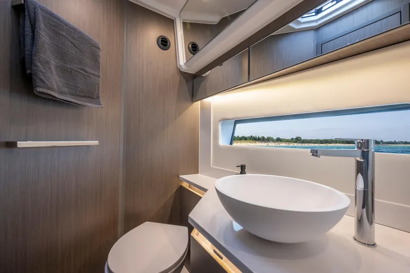 Slide: The Image of Modern bathroom interior of 2026 Jeanneau NC1295 Coupe yacht with sleek design and ocean view. - 19