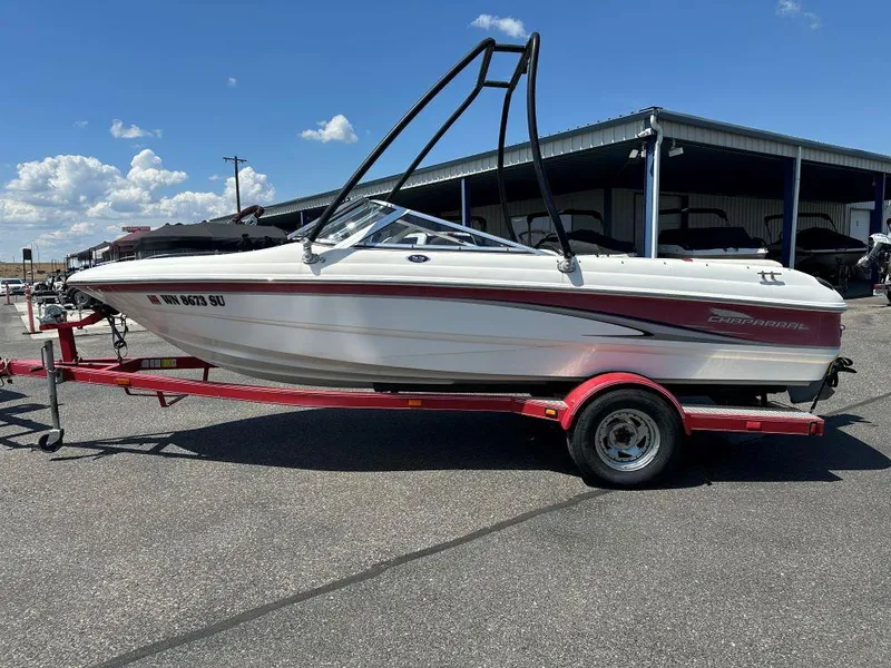 Slide: The Image of 2003 Chaparral 180 SS boat on trailer under clear blue sky. - 1