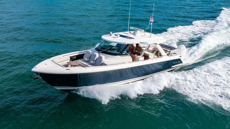 Slide: The Image of 2022 Tiara Yachts 43 LS cruising on open water, showcasing sleek design and performance. - 0