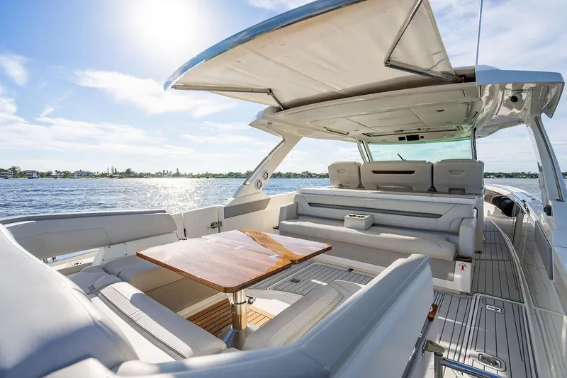 Slide: The Image of Luxurious 2022 Tiara Yachts 43 LS with spacious seating and elegant design on open water. - 11