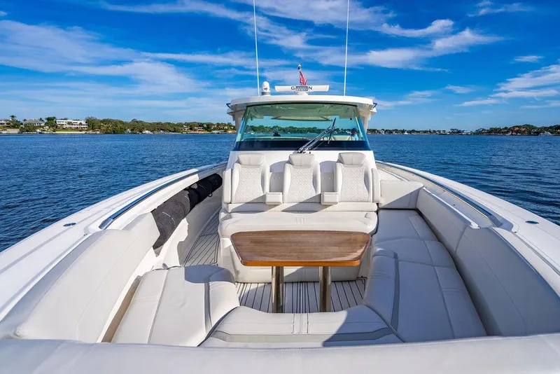 Slide: The Image of 2022 Tiara Yachts 43 LS luxury boat with spacious seating on calm water. - 19