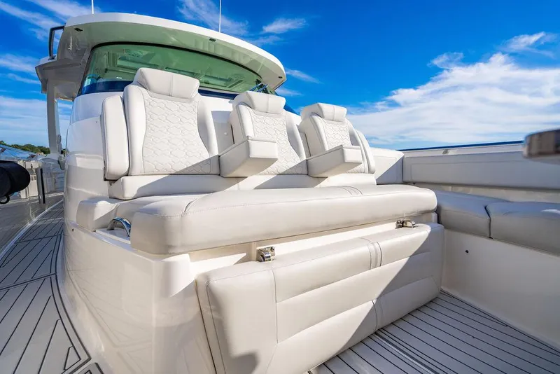 Slide: The Image of 2022 Tiara Yachts 43 LS luxury seating with elegant design under a clear blue sky. - 20