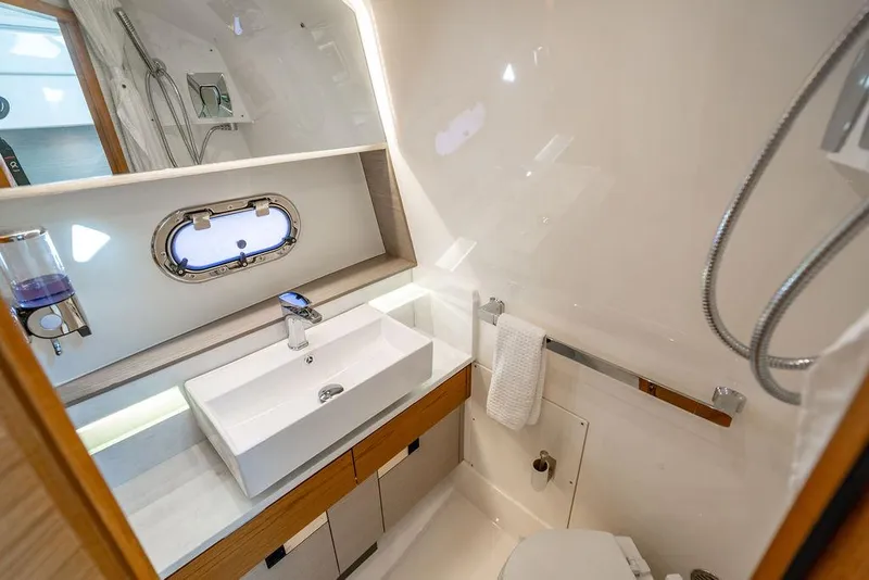Slide: The Image of Luxurious bathroom in 2022 Tiara Yachts 43 LS, featuring modern sink and shower. - 22