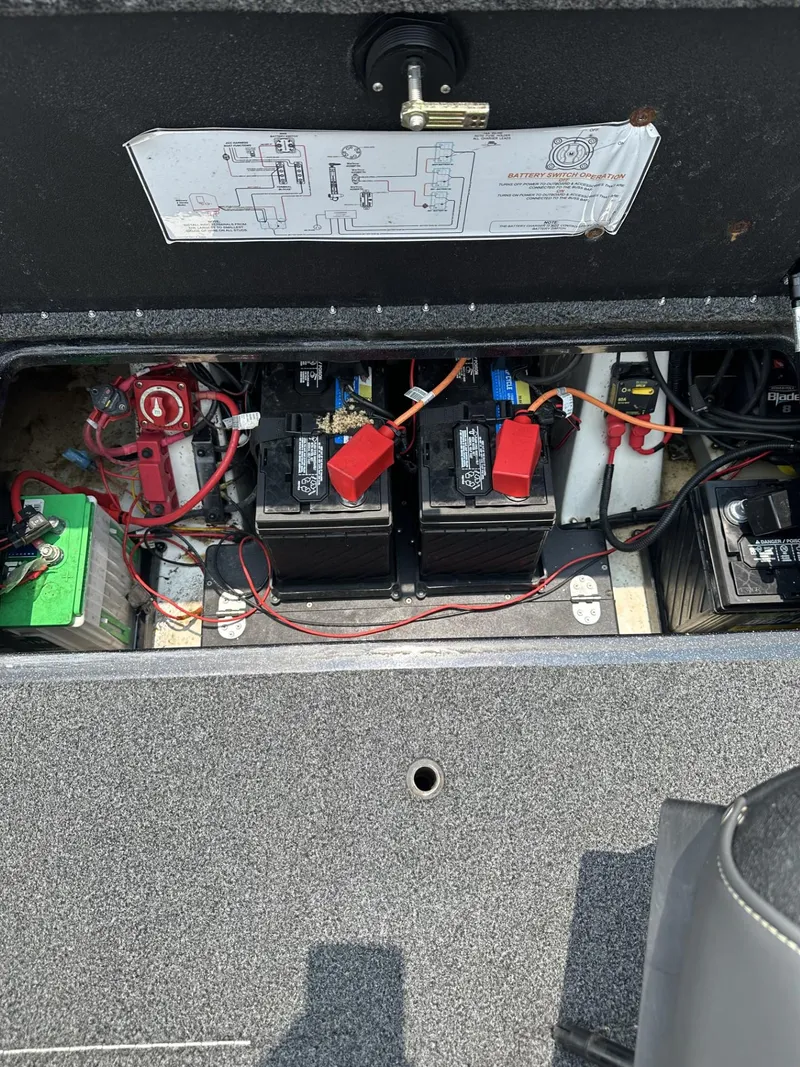 Slide: The Image of 2024 Nitro Z19 boat battery compartment with wiring and components. - 10