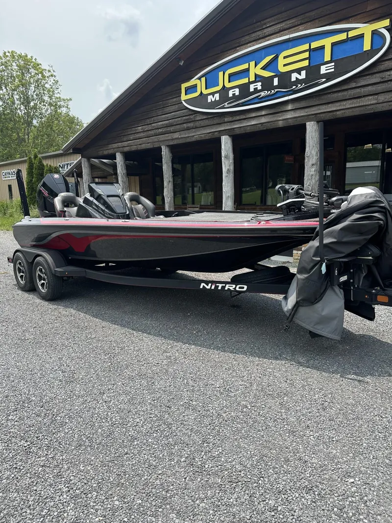Slide: The Image of 2024 Nitro Z19 boat at Duckett Marine dealership, parked on gravel. - 3