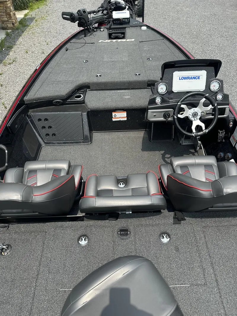 Slide: The Image of 2024 Nitro Z19 boat interior with steering wheel and Lowrance display. - 6