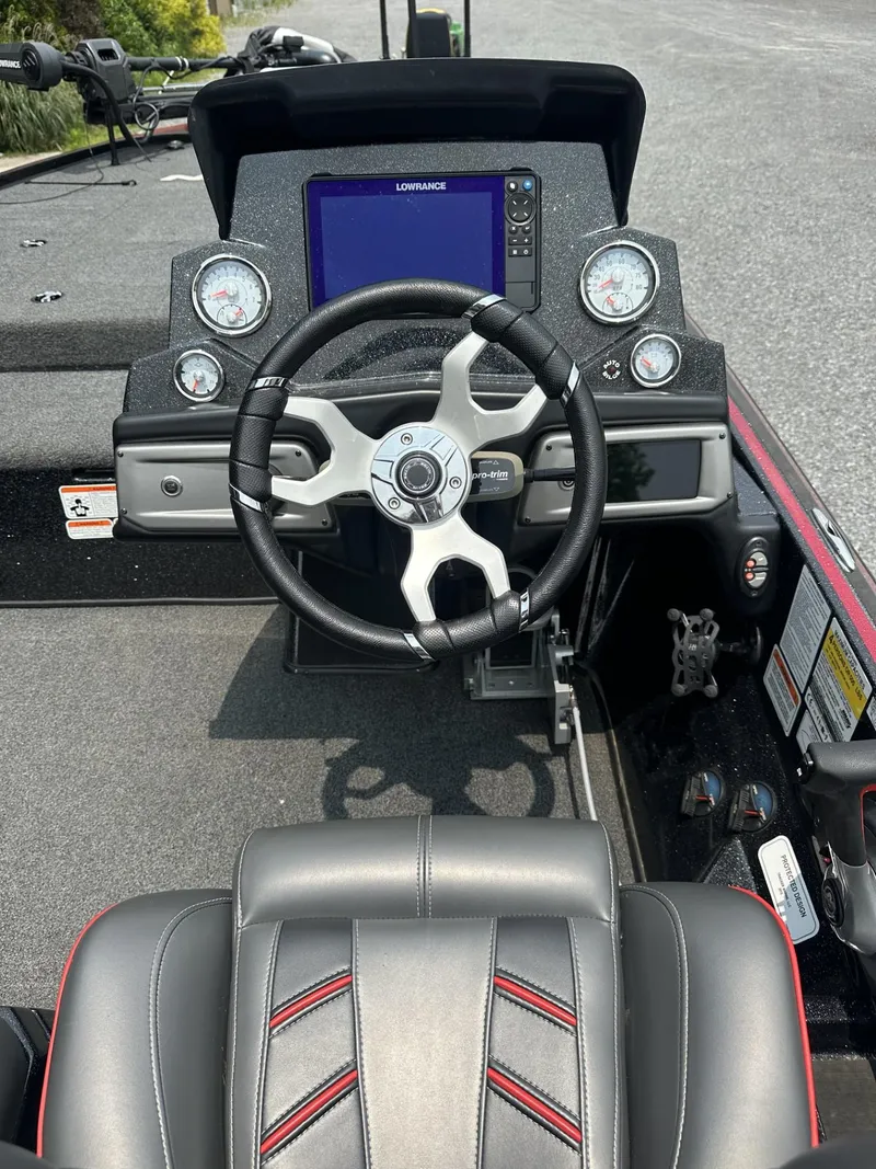 Slide: The Image of 2024 Nitro Z19 boat dashboard with steering wheel and navigation display. - 7