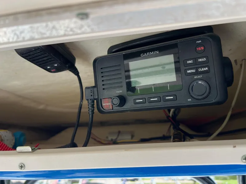 Slide: The Image of Garmin marine radio installed on a 2018 Robalo 246 Cayman boat. - 18