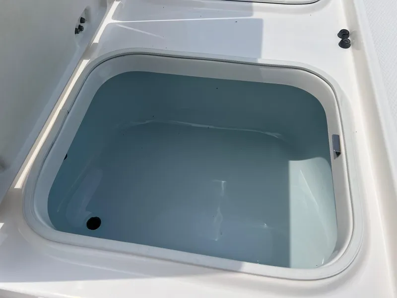 Slide: The Image of Livewell compartment on 2018 Robalo 246 Cayman boat, open and empty. - 23