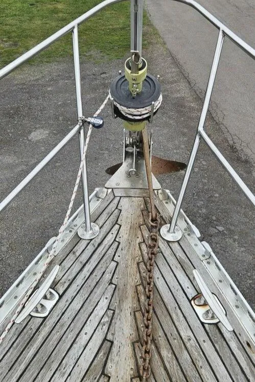 Slide: The Image of Bow of 1983 Cheoy Lee Pedrick 41 sailboat with anchor chain and wooden deck. - 10