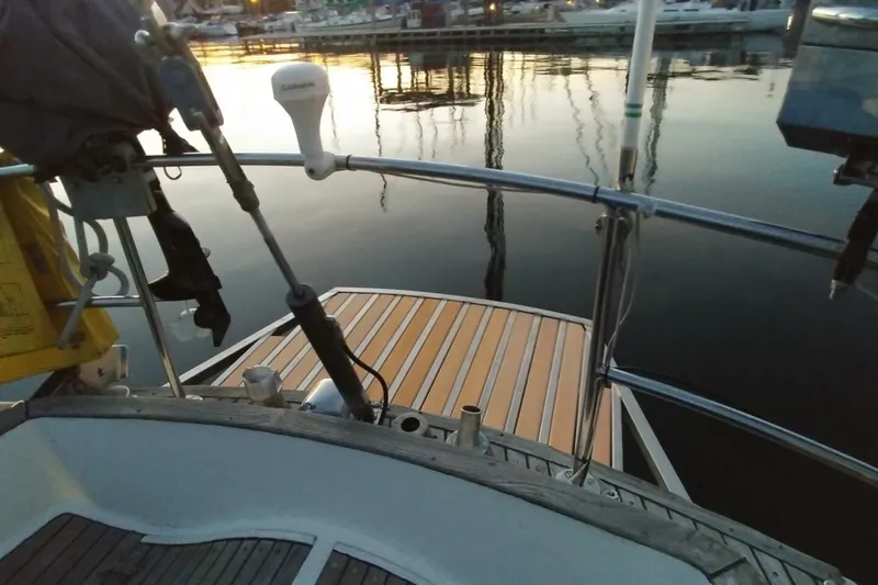 Slide: The Image of 1983 Cheoy Lee Pedrick 41 sailboat stern with wooden deck at marina. - 21