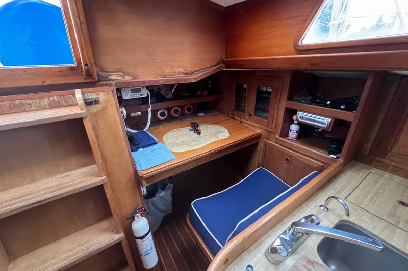 Slide: The Image of 1983 Cheoy Lee Pedrick 41 yacht interior with navigation station and wooden cabinetry. - 27