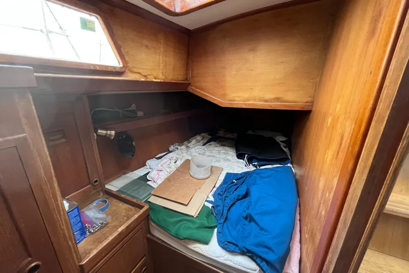 Slide: The Image of Cozy cabin interior of 1983 Cheoy Lee Pedrick 41 sailboat with wooden furnishings. - 31