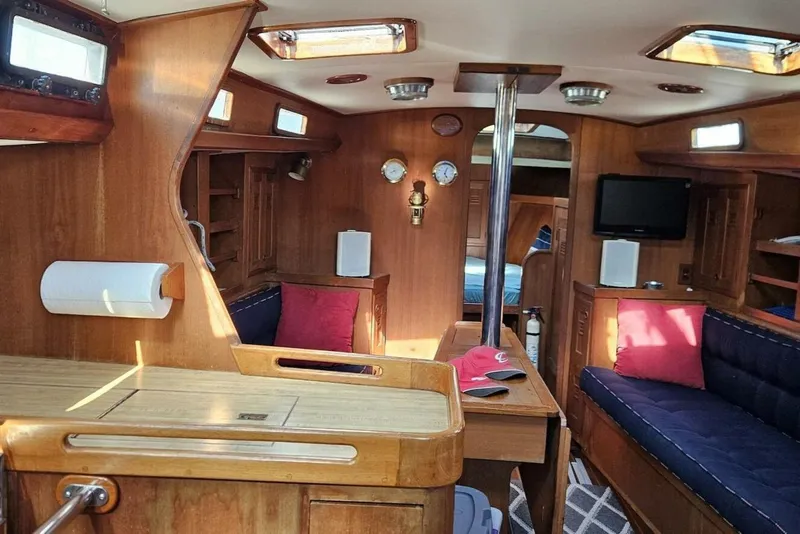 Slide: The Image of Interior of 1983 Cheoy Lee Pedrick 41 sailboat with wood finish and cozy seating. - 36