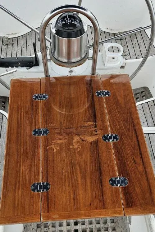 Slide: The Image of Wooden helm station on 1983 Cheoy Lee Pedrick 41 sailboat with compass. - 40