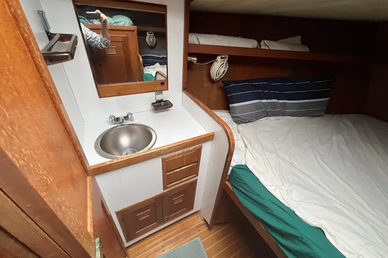 Slide: The Image of Cozy cabin interior of 1983 Cheoy Lee Pedrick 41 with sink and bed. - 44