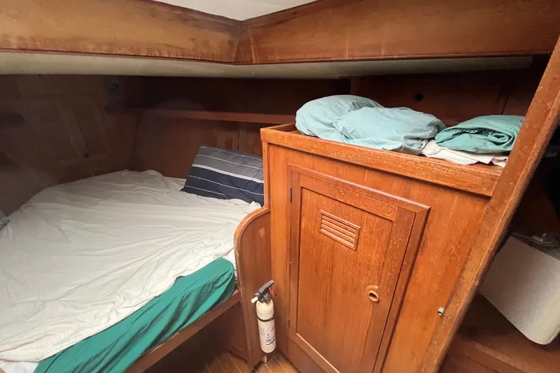 Slide: The Image of Cozy cabin interior of 1983 Cheoy Lee Pedrick 41 sailboat with wooden furnishings. - 45
