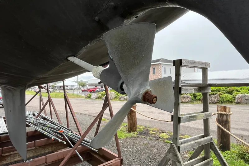 Slide: The Image of Propeller of 1983 Cheoy Lee Pedrick 41 sailboat on dry dock with ladder nearby. - 6
