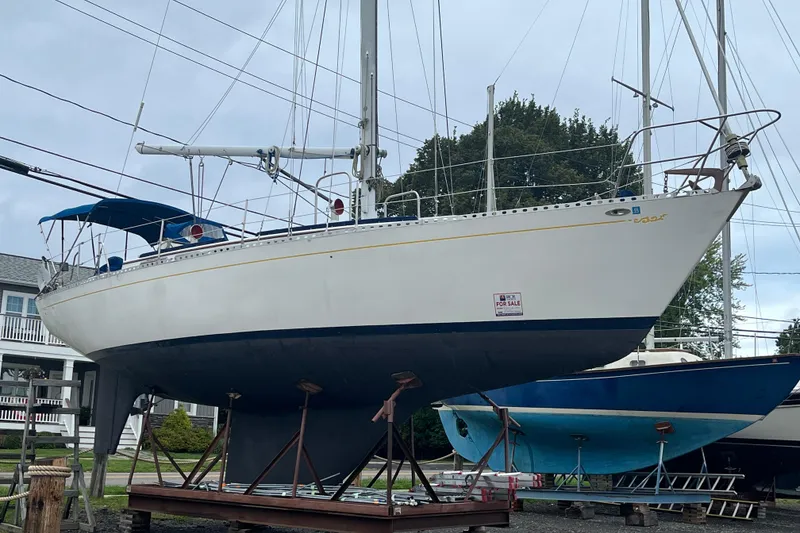 Slide: The Image of 1983 Cheoy Lee Pedrick 41 sailboat on stands, for sale, with blue canopy. - 8