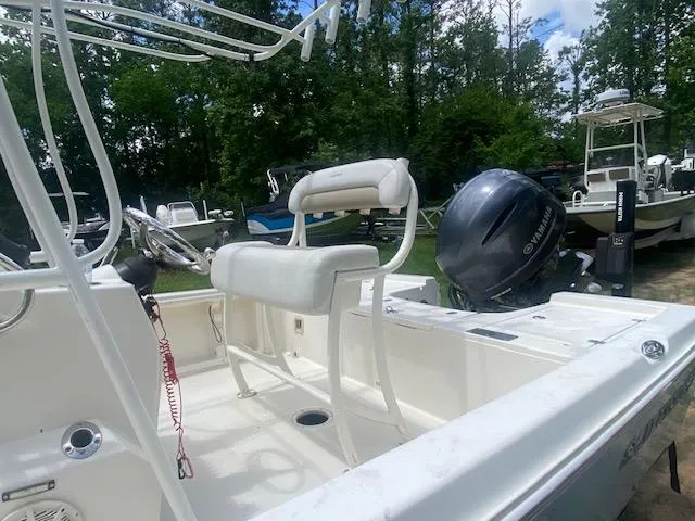 Slide: The Image of 2017 Sailfish 2100 BB Bay Boat with Yamaha outboard, parked outdoors. - 13