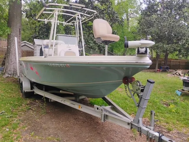 Slide: The Image of 2017 Sailfish 2100 BB Bay Boat on trailer in a grassy yard. - 5