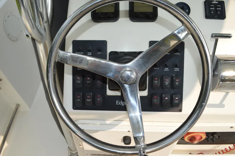 Slide: The Image of Steering wheel and control panel of 2007 Edgewater 228CC boat. - 17
