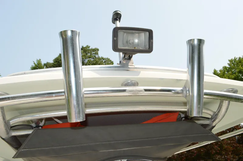 Slide: The Image of Close-up of 2007 Edgewater 228CC boat's rod holders and light fixture. - 28