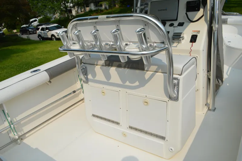 Slide: The Image of 2007 Edgewater 228CC boat interior with rod holders and control panel. - 37