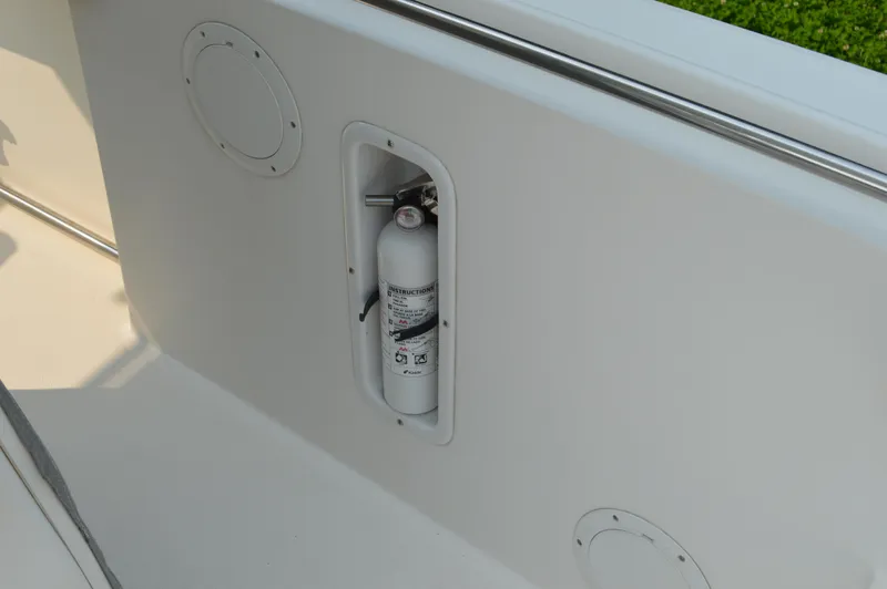 Slide: The Image of Fire extinguisher mounted on 2007 Edgewater 228CC boat interior. - 39