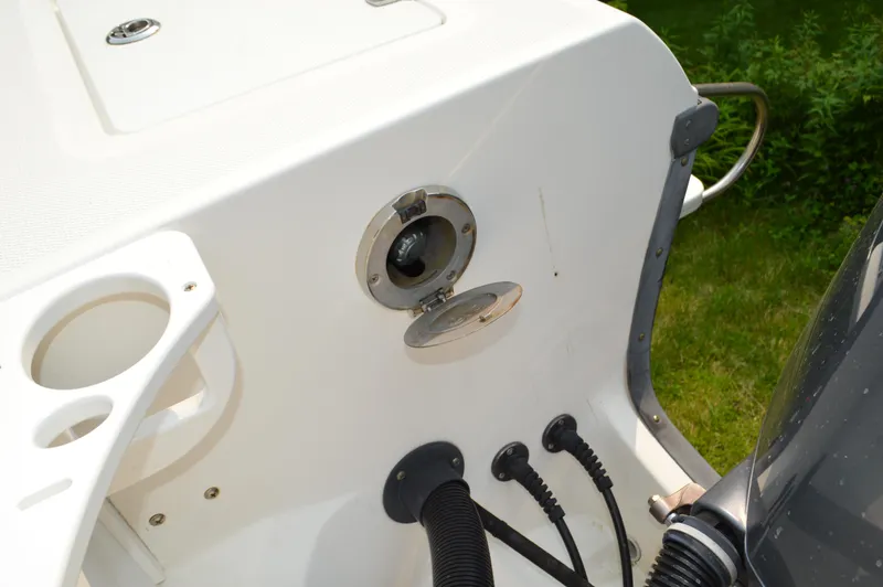 Slide: The Image of 2007 Edgewater 228CC boat fuel cap and connections on deck. - 40