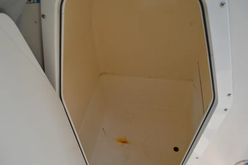 Slide: The Image of Storage compartment of a 2007 Edgewater 228CC boat, showing interior space. - 41