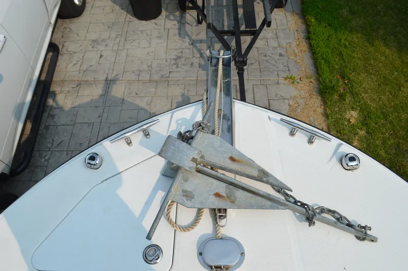 Slide: The Image of Bow of 2007 Edgewater 228CC boat with anchor and trailer. - 44