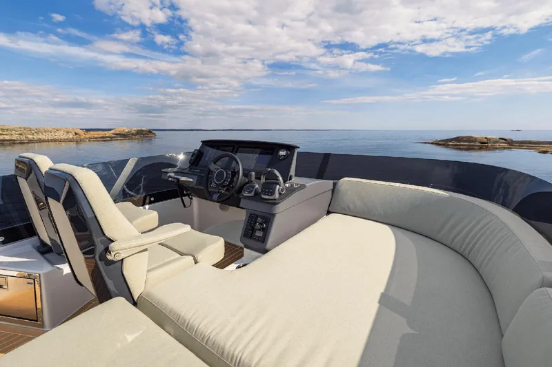 Slide: The Image of 2025 Nimbus 495 Flybridge yacht interior with luxurious seating and ocean view. - 17